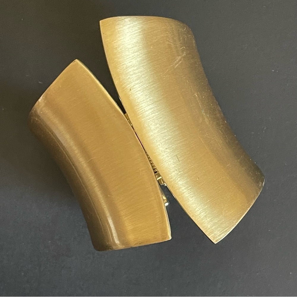 Matte gold tone large bangle.